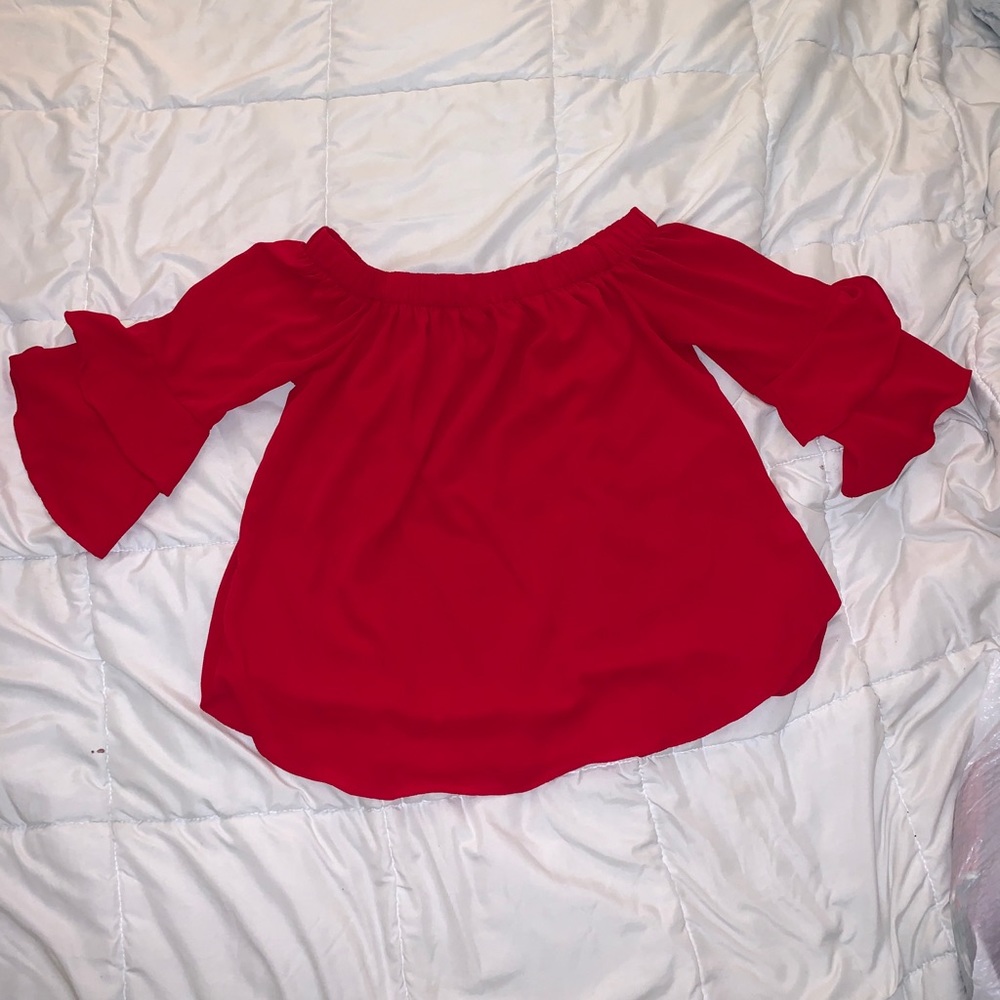 Red over the shoulder blouse with ruffled sleeves